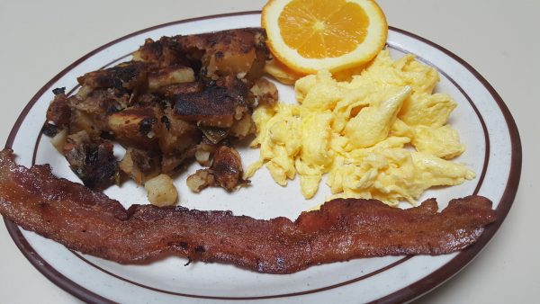 1 egg, 1 piece of Bacon with country potatoes